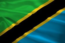 Tanzania flag blowing in the wind. Background texture.
